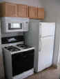 Blair St downstairs kitchen with new appliances.JPG (75002 bytes)